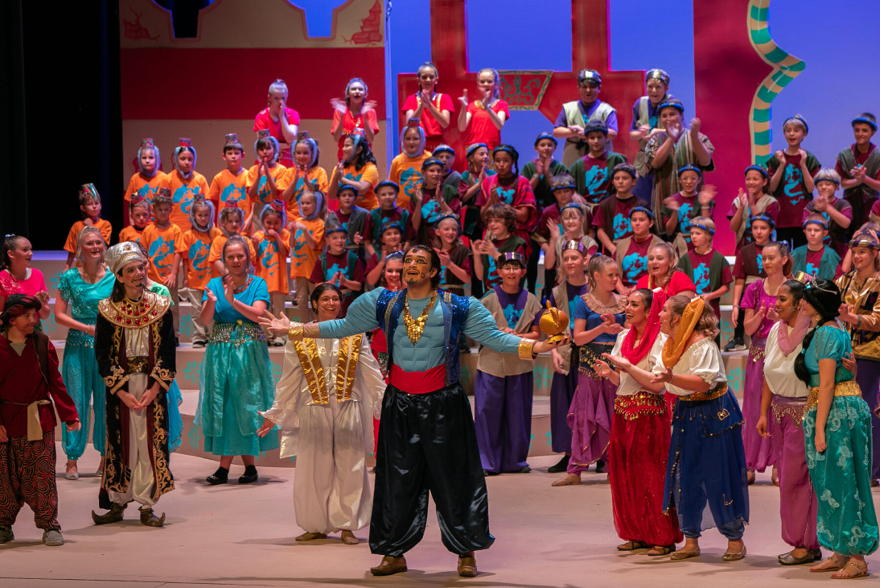 Students on stage during the Webb summer camp performance of Aladdin.